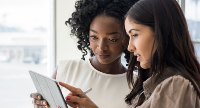 two young woman on tablet